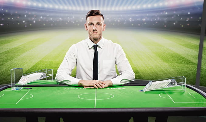 Auf dem Bild sind zwei echte Dealer zu erkennen, die das Live Football Studio Spiel von Evolution Gaming moderieren.